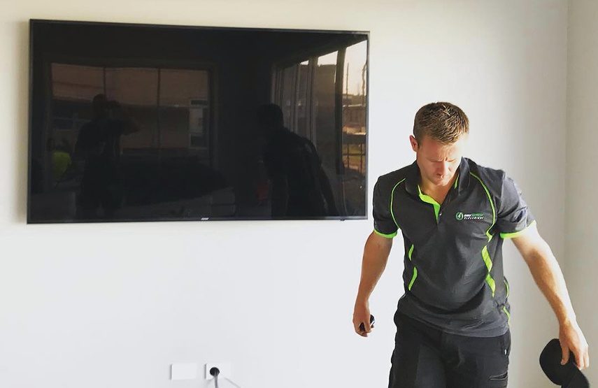 An electrician installing data cabling in Sydney